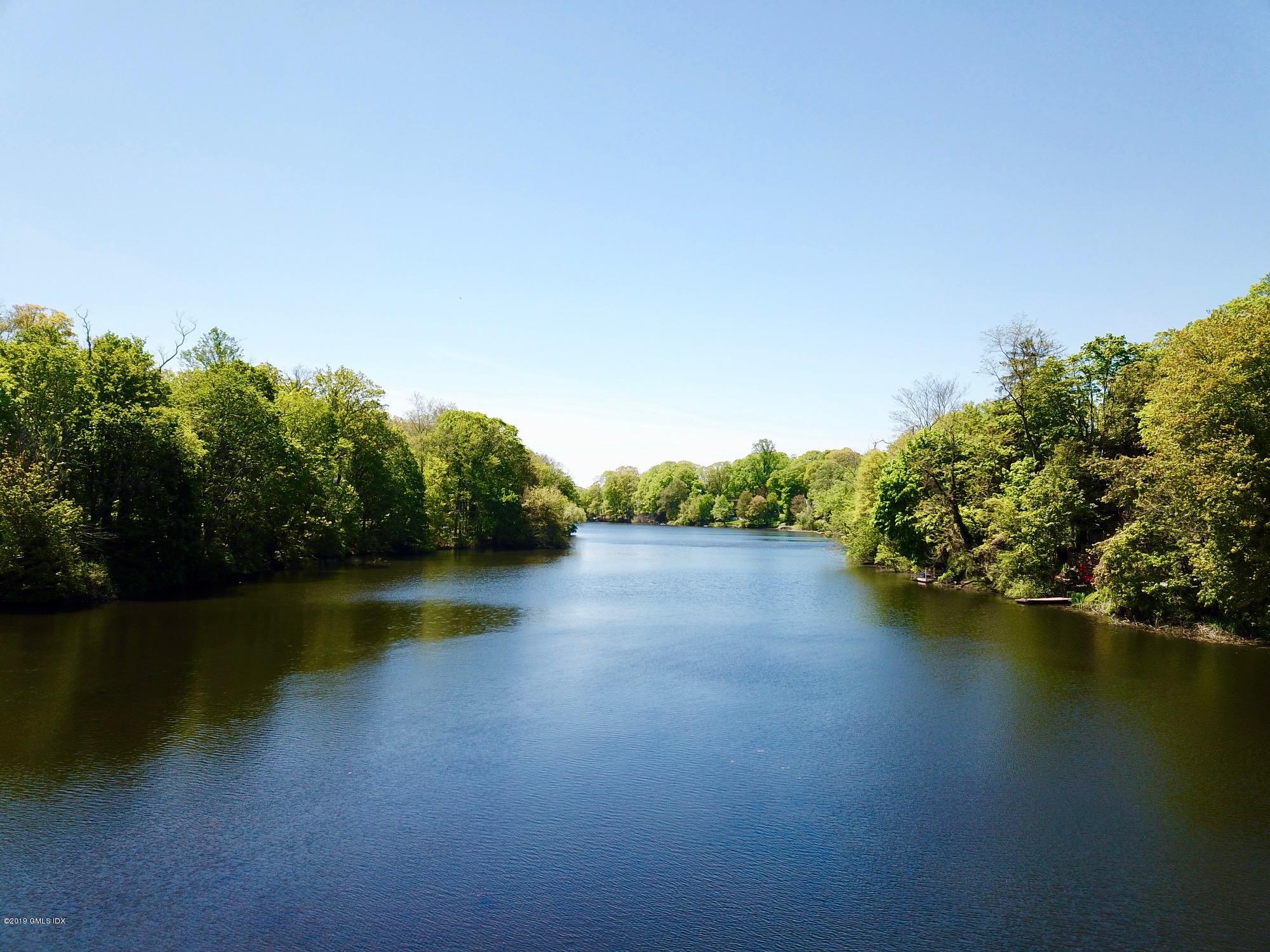 271 Valley Road Cos Cob, CT 06807 - Photo 41 of 42 a view of a lake with houses