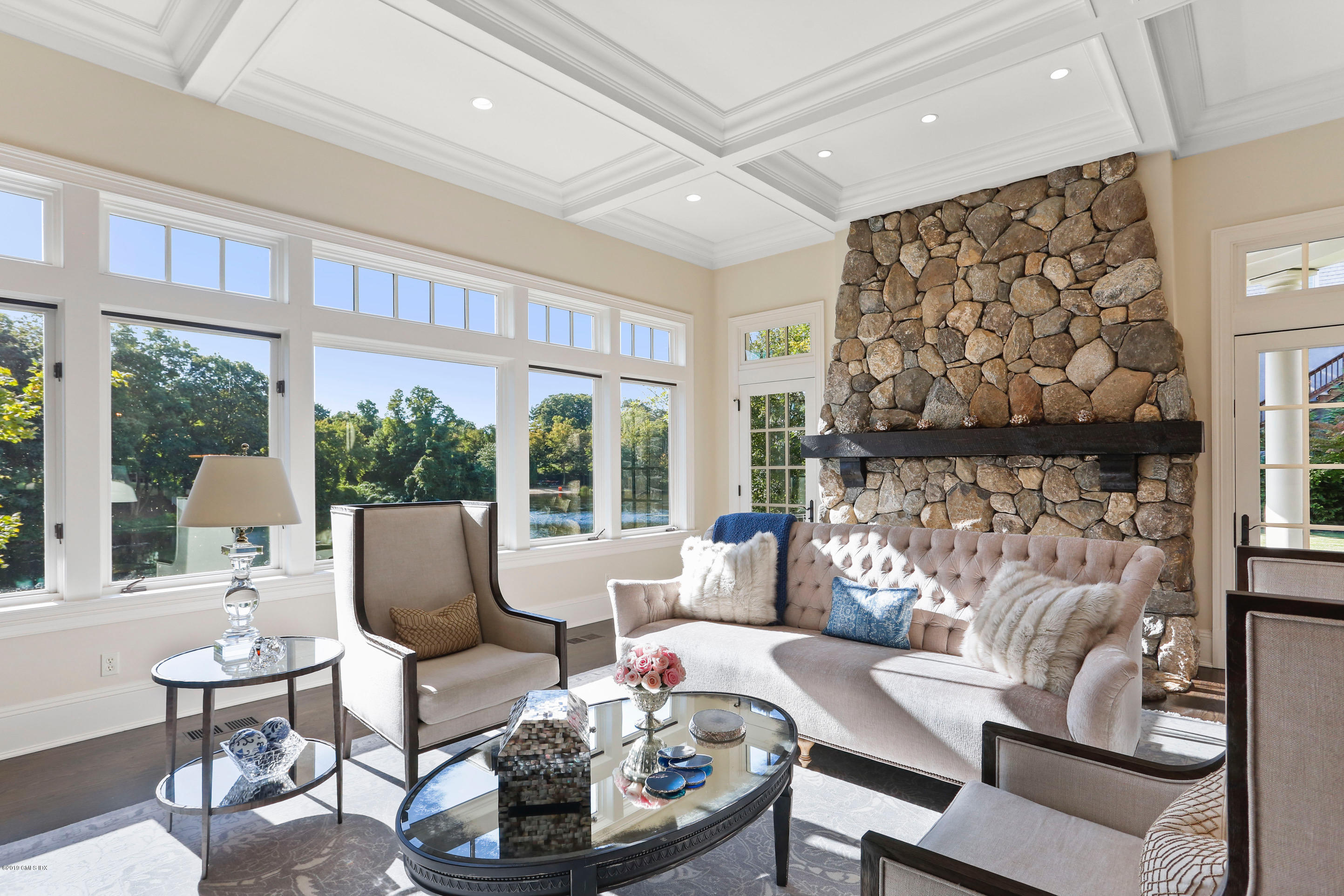 271 Valley Road Cos Cob, CT 06807 - Photo 10 of 42 a living room with fireplace furniture and a large window