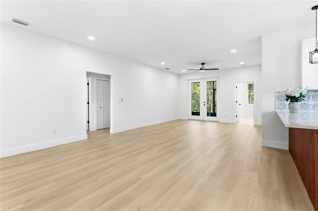 126 Canby Circle Spring Hill, FL 34606 - Photo 12 of 37 an empty room with wooden floor and windows