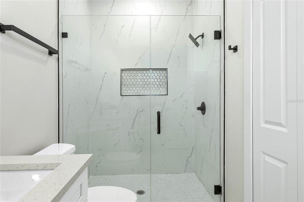 126 Canby Circle Spring Hill, FL 34606 - Photo 20 of 37 a bathroom with a sink a toilet and shower