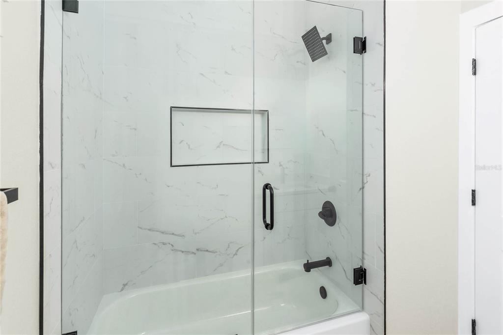 126 Canby Circle Spring Hill, FL 34606 - Photo 23 of 37 a bathroom with a shower