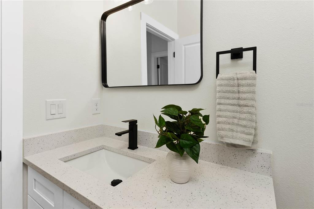 126 Canby Circle Spring Hill, FL 34606 - Photo 24 of 37 a bathroom with a sink and a mirror