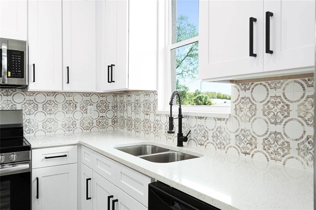 126 Canby Circle Spring Hill, FL 34606 - Photo 10 of 37 a kitchen with a sink and cabinets