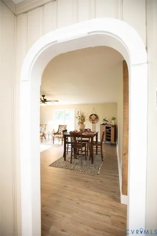 a view of a hallway with wooden floor