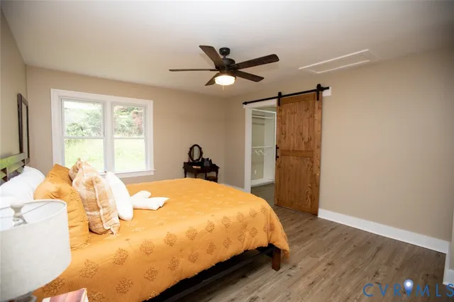 a bathroom with a sink a toilet a tub and shower