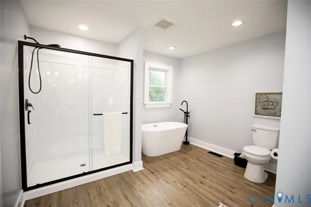 a bedroom with a large bed and a large window