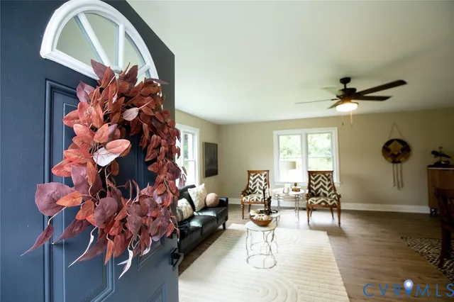 a living room with furniture and a window
