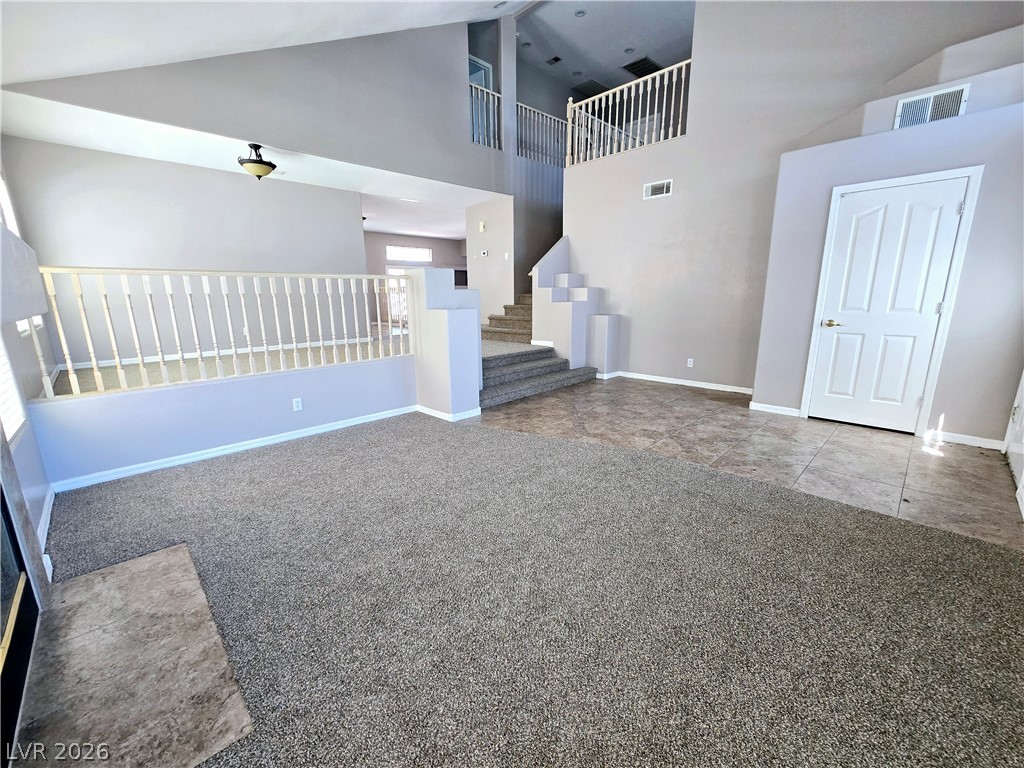 3759 Funston Way Las Vegas, NV 89129 - Photo 27 of 31 A spacious common area boasts soaring ceilings and mixed flooring.