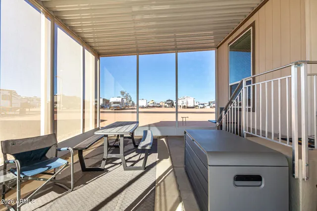 a view of a floor to ceiling window with wooden floor