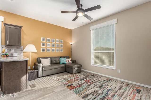 a living room with furniture and a window