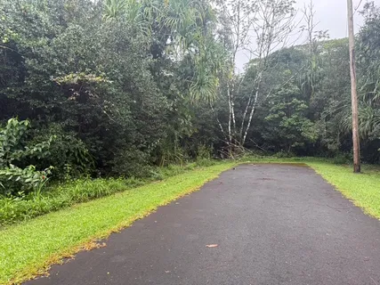 a view of a road with a yard