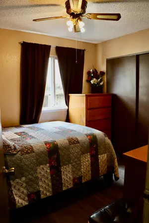 a bedroom with a bed and a closet