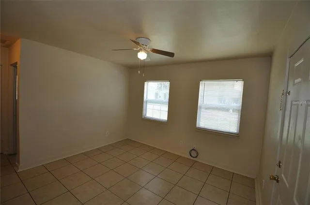 a view of an empty room and window