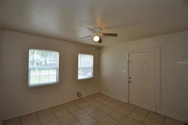 a view of an empty room with a window