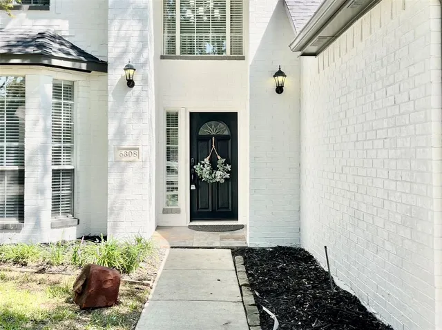 a view of a entryway door front of a house
