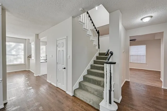 a view of entryway with wooden floor