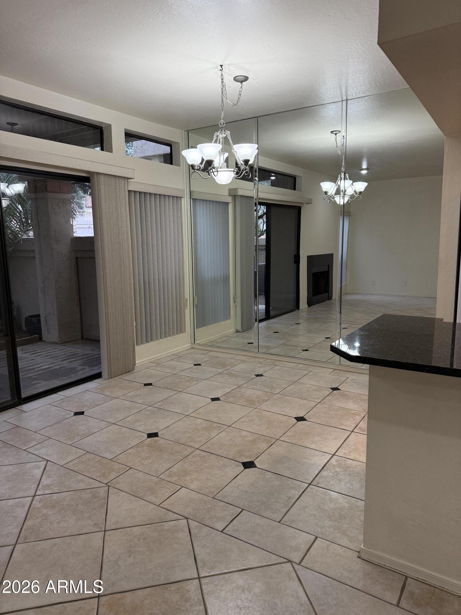 9705 East Mountain View Road, Unit 1019 Scottsdale, AZ 85258 - Photo 11 of 32 a view of a chandelier and entryway