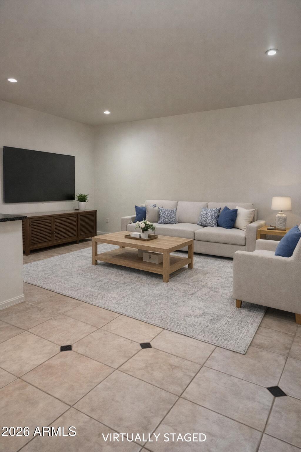 9705 East Mountain View Road, Unit 1019 Scottsdale, AZ 85258 - Photo 13 of 32 a living room with furniture and a flat screen tv