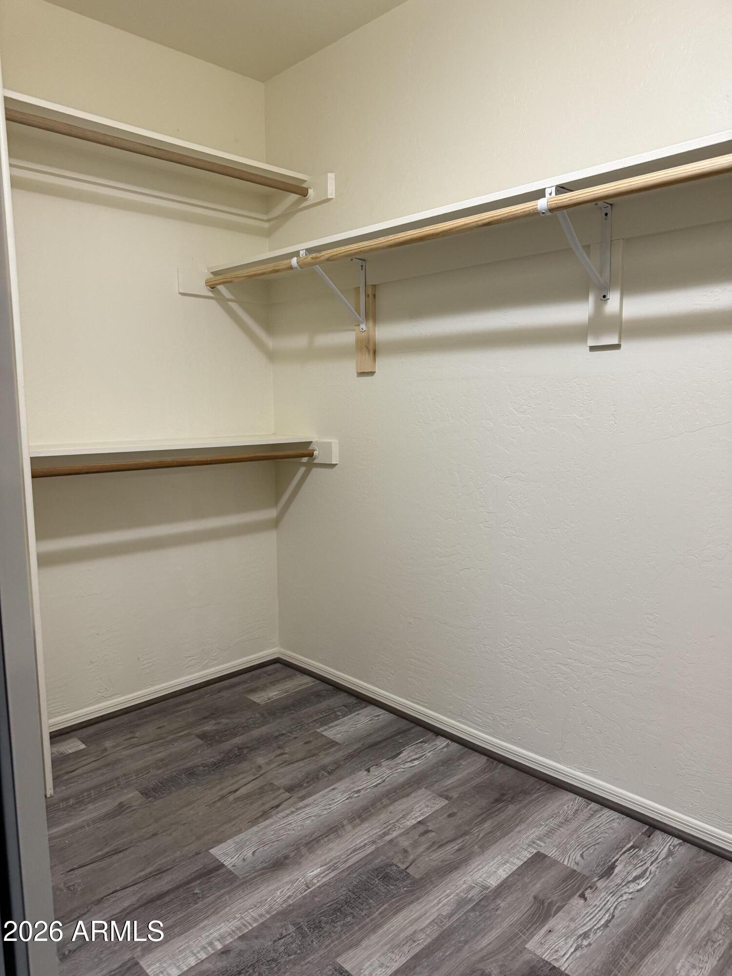 9705 East Mountain View Road, Unit 1019 Scottsdale, AZ 85258 - Photo 23 of 32 a view of an empty walk in closet