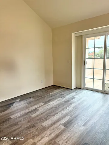 a spacious bathroom with double sink and a mirror