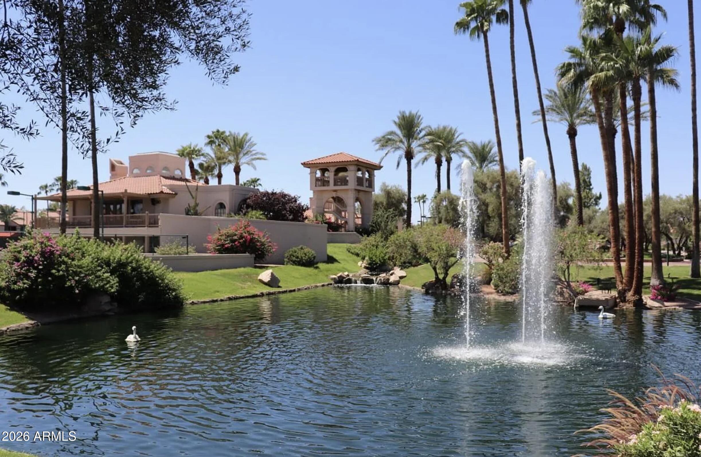 9705 East Mountain View Road, Unit 1019 Scottsdale, AZ 85258 - Photo 32 of 32 a view of a water with a fountain in a yard