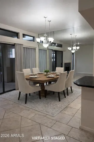 a kitchen with a sink a microwave and cabinets