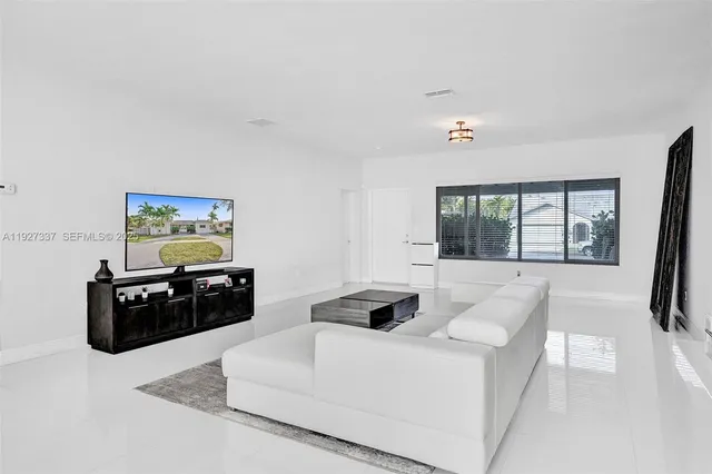 a kitchen with stainless steel appliances granite countertop a stove a refrigerator and a sink