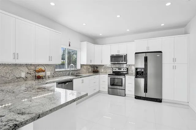 a view of a workspace with wooden floor and chair