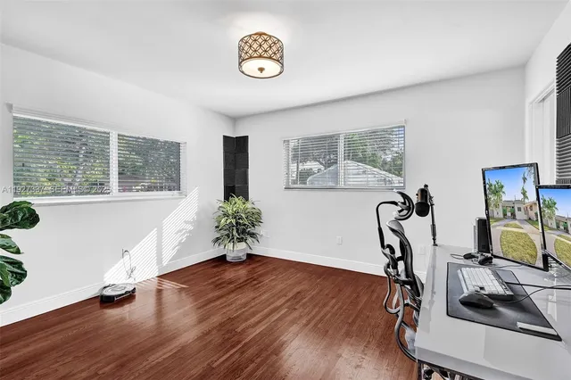 a bedroom with a bed and a lamp