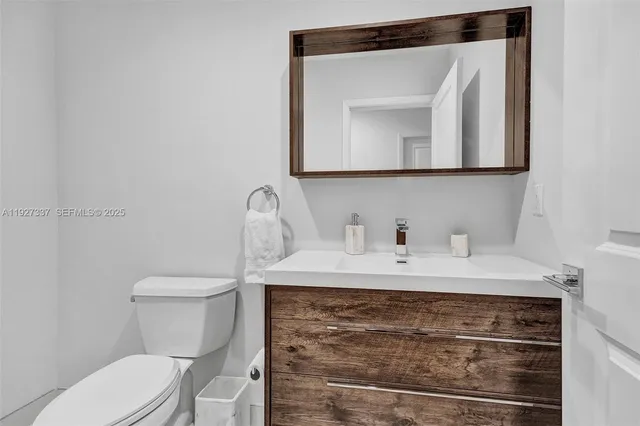 a view of a backyard with wooden fence