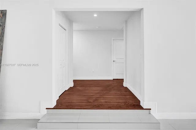 an aerial view of residential building and lake