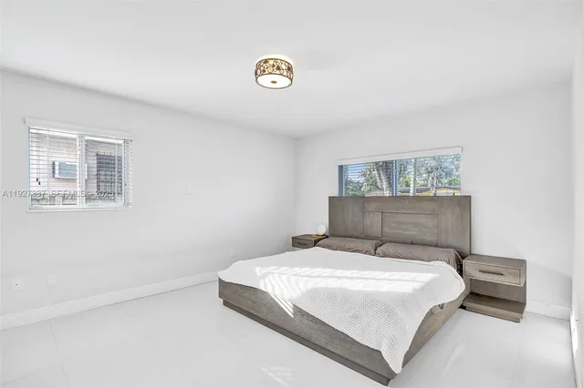 an aerial view of residential building with green space