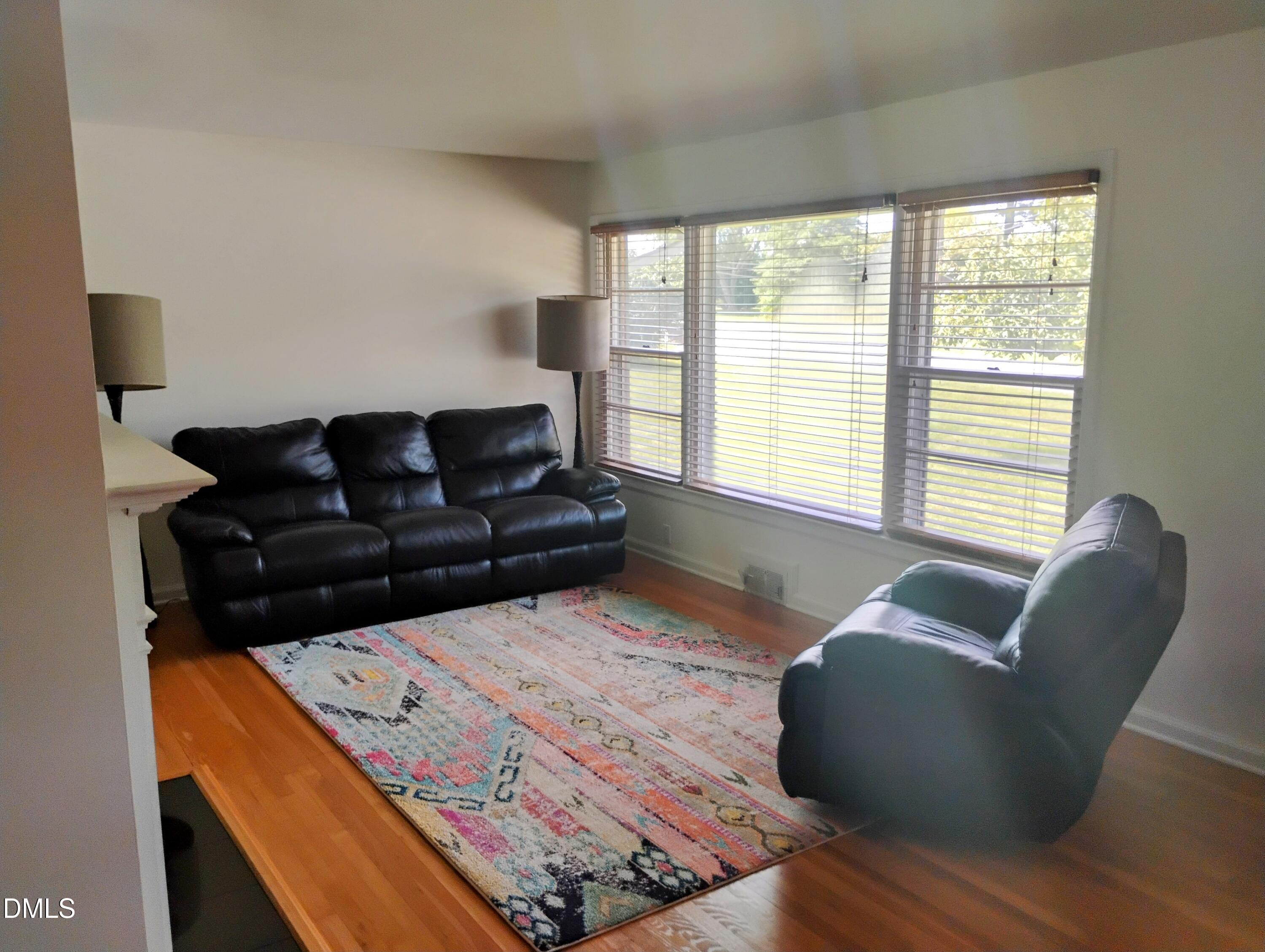 6121 Yates Mill Pond Road Raleigh, NC 27606 - Photo 6 of 18 a living room with furniture and a large window
