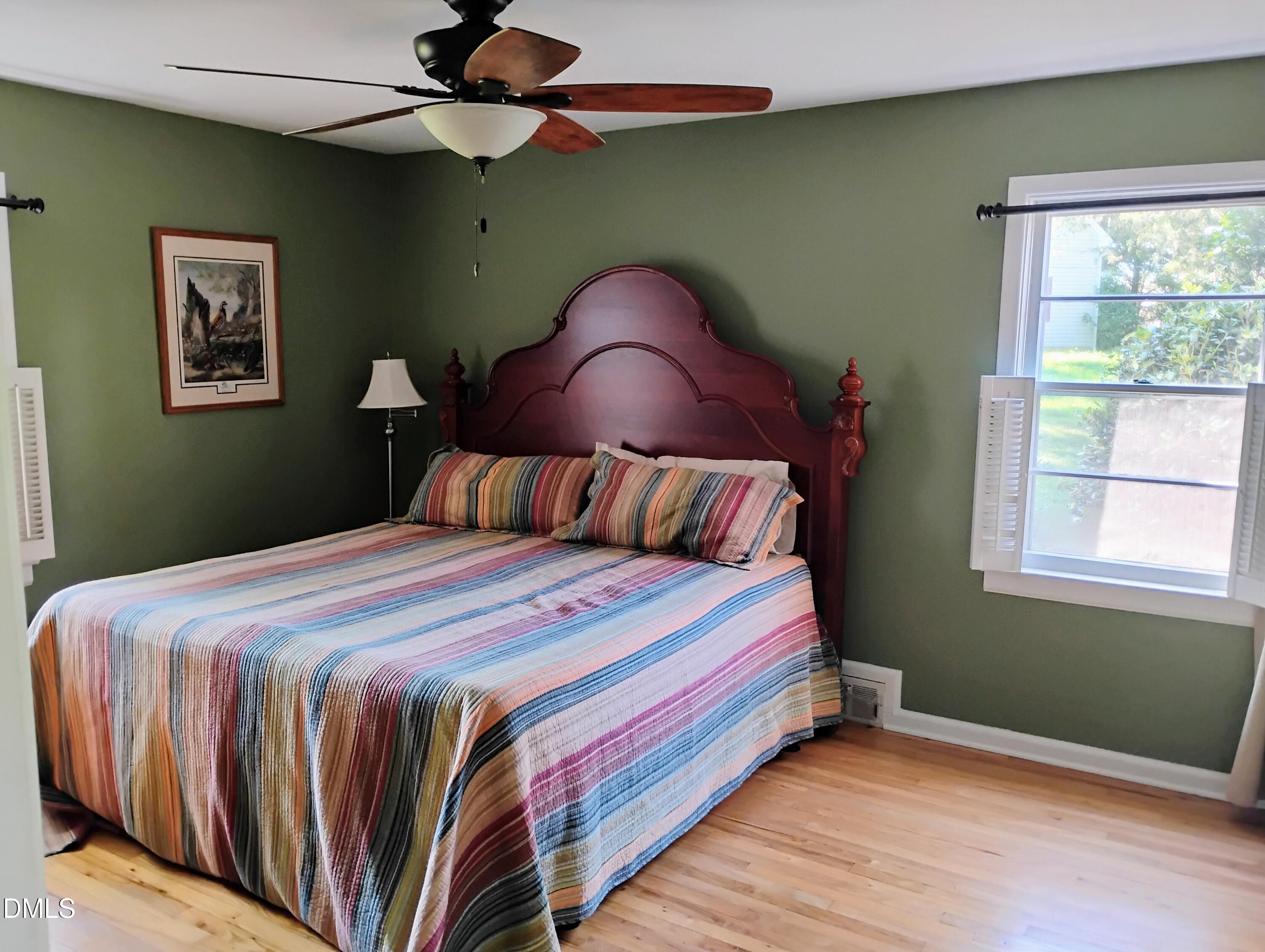 6121 Yates Mill Pond Road Raleigh, NC 27606 - Photo 7 of 18 a bedroom with a bed and window