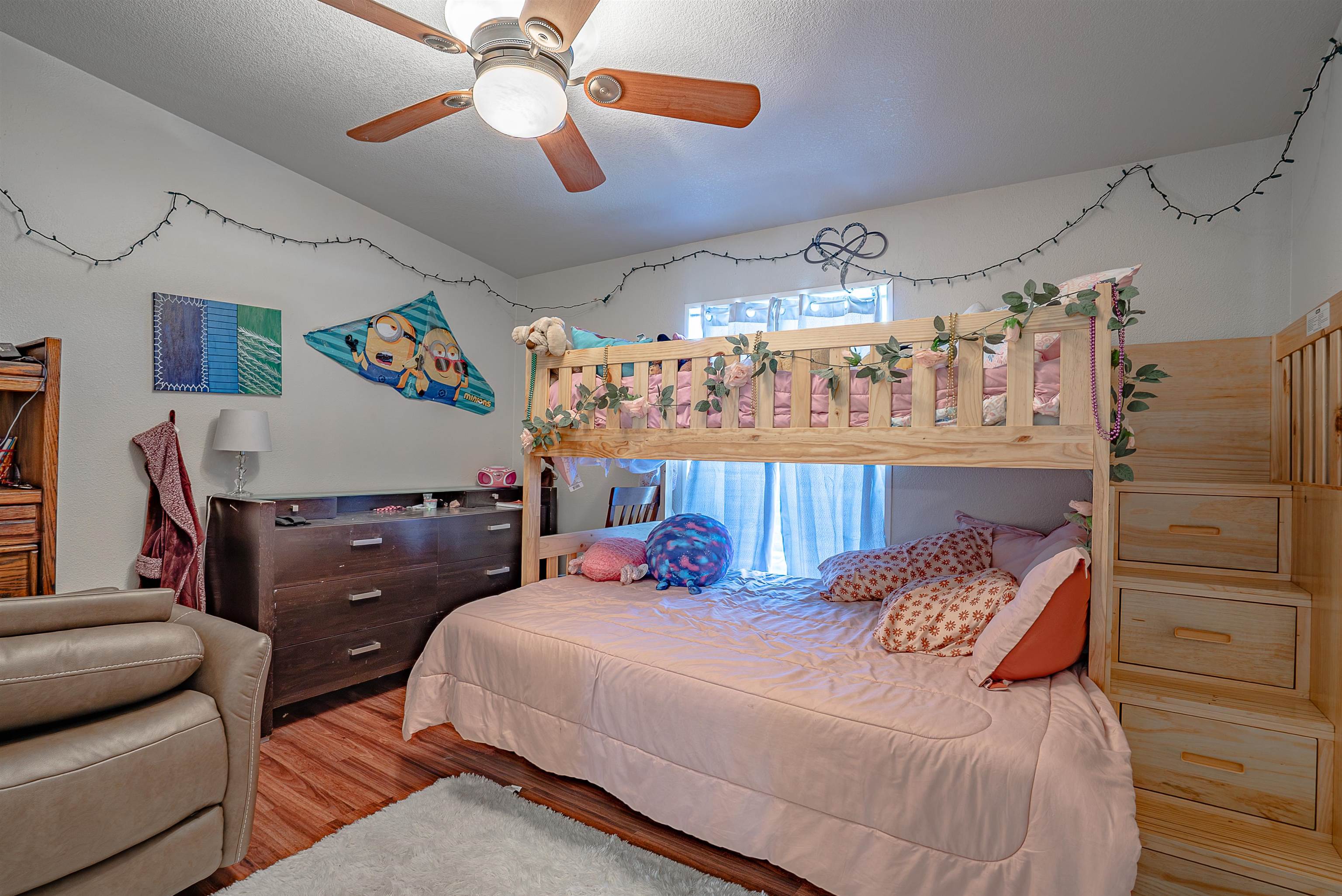 714-100 Sears Road Janesville, CA 96114 - Photo 19 of 35 a bedroom with a bed and a chandelier