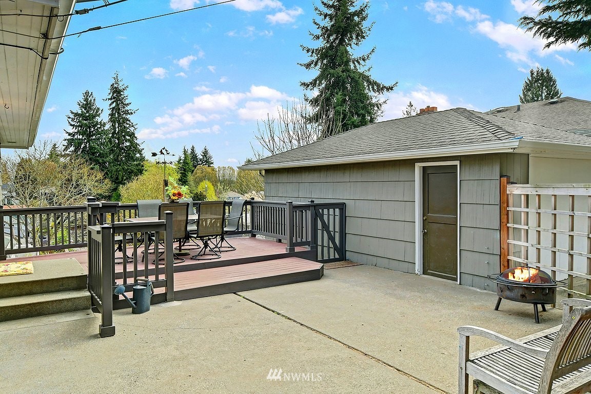 8202 37th Avenue Southwest Seattle, WA 98126 - Photo 19 of 27 a view of a patio with a table and chairs