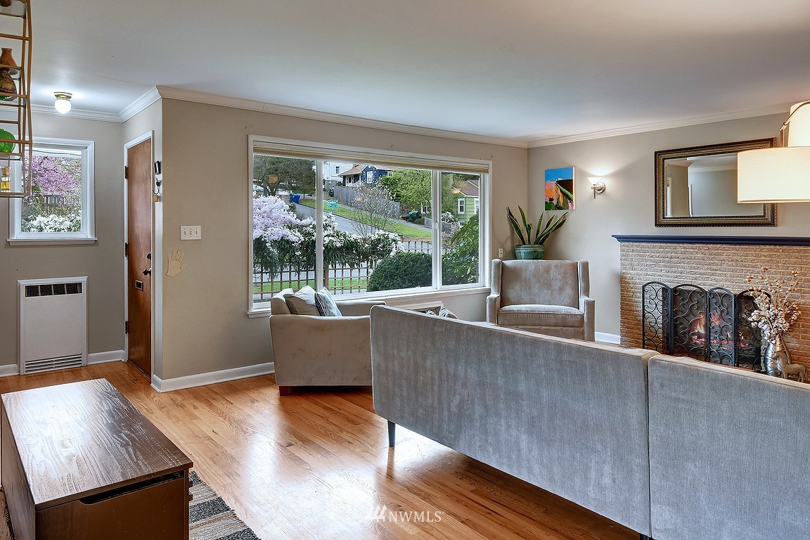 8202 37th Avenue Southwest Seattle, WA 98126 - Photo 2 of 27 a living room with furniture and a fireplace