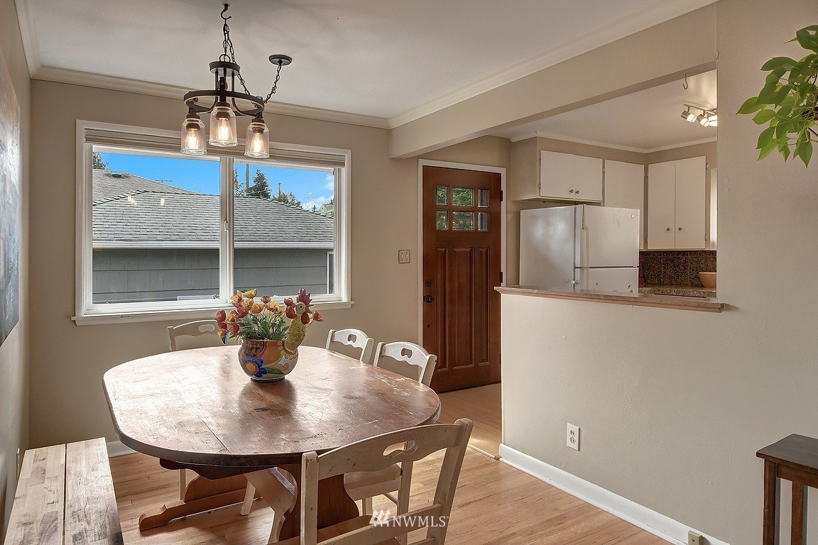 8202 37th Avenue Southwest Seattle, WA 98126 - Photo 5 of 27 a view of a dining room with furniture and window