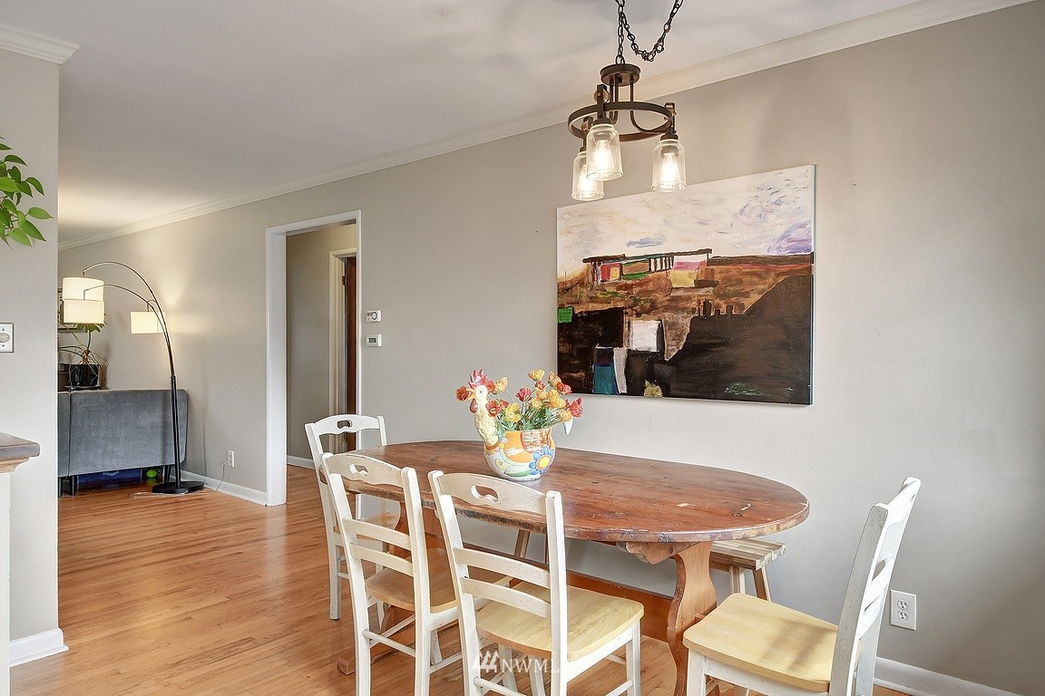 8202 37th Avenue Southwest Seattle, WA 98126 - Photo 6 of 27 a view of a dining room with furniture and wooden floor
