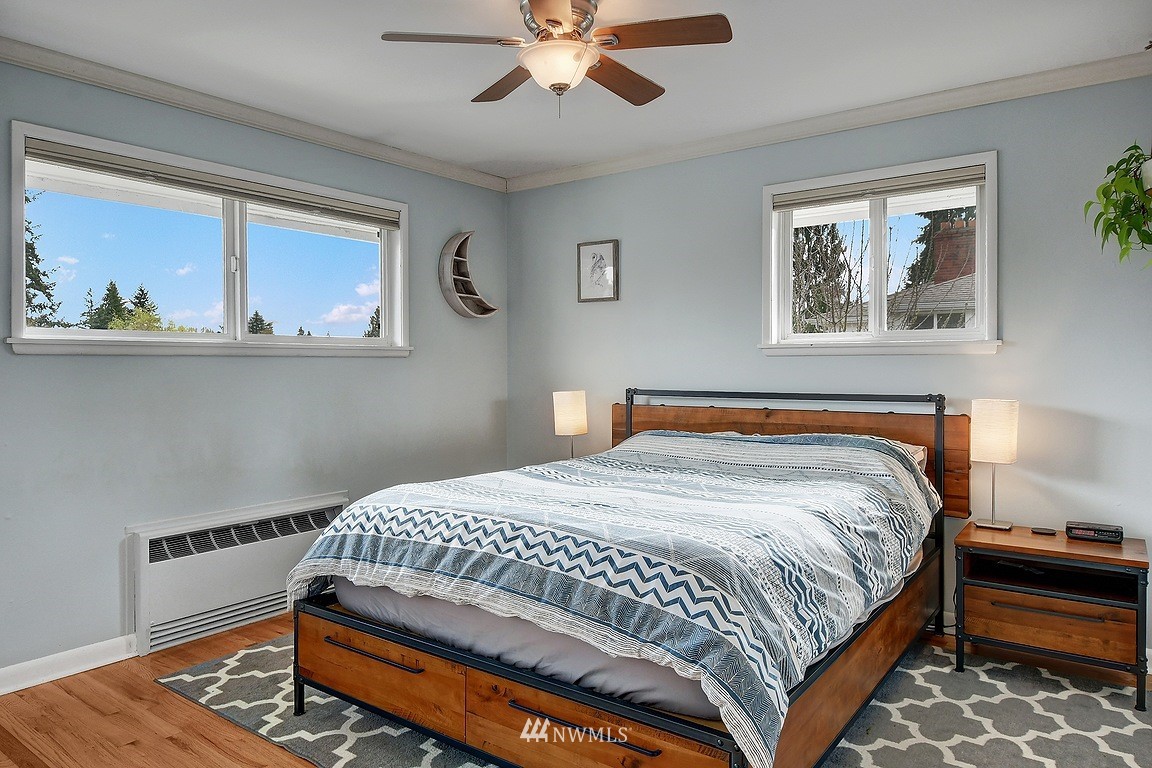 8202 37th Avenue Southwest Seattle, WA 98126 - Photo 9 of 27 a bedroom with a bed and a window