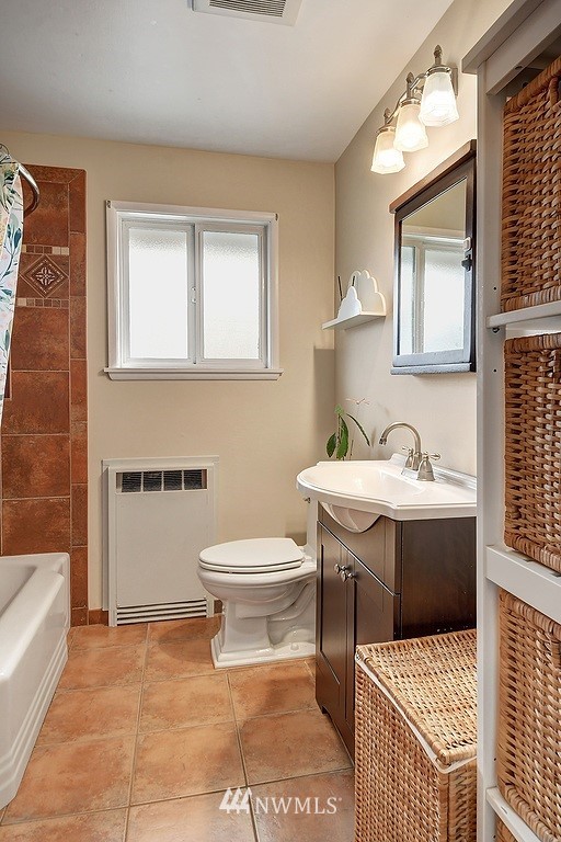 8202 37th Avenue Southwest Seattle, WA 98126 - Photo 10 of 27 a bathroom with a sink toilet and shower