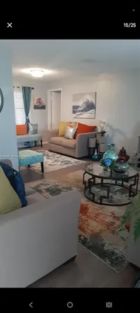 a living room with furniture and a table