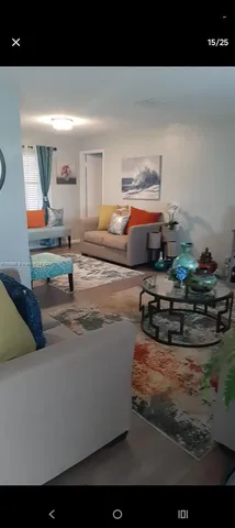 a living room with furniture and a table