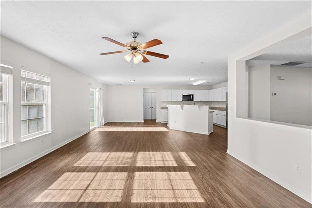 2068 White Top Road Southeast Lawrenceville, GA 30045 - Photo 12 of 41 a view of a living room with a rug and wooden floor