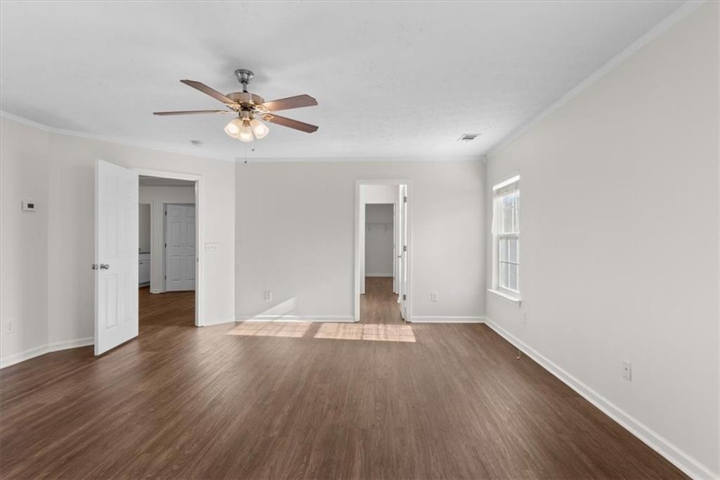 2068 White Top Road Southeast Lawrenceville, GA 30045 - Photo 24 of 41 a view of an empty room with window and wooden floor
