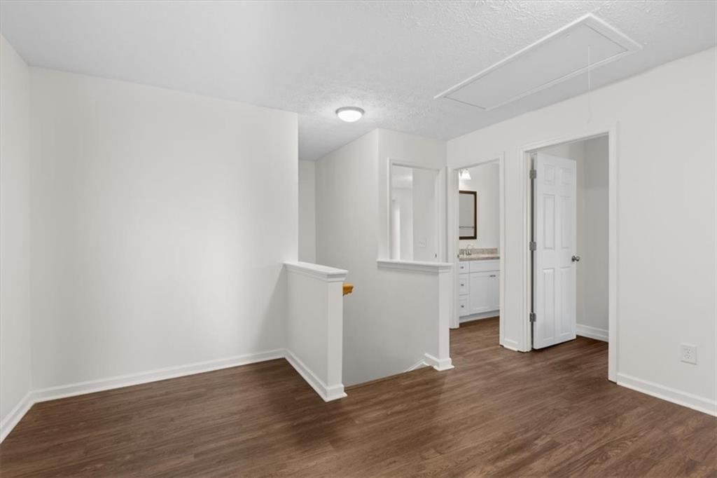 2068 White Top Road Southeast Lawrenceville, GA 30045 - Photo 29 of 41 an empty room with wooden floor & windows