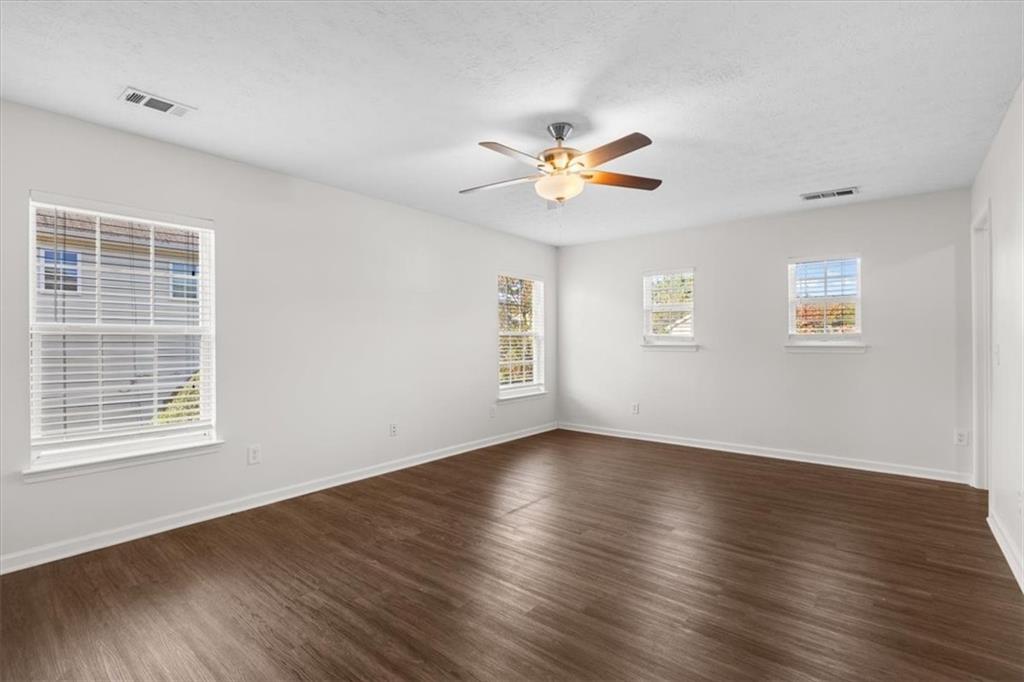 2068 White Top Road Southeast Lawrenceville, GA 30045 - Photo 30 of 41 a view of an empty room with a window and wooden floor