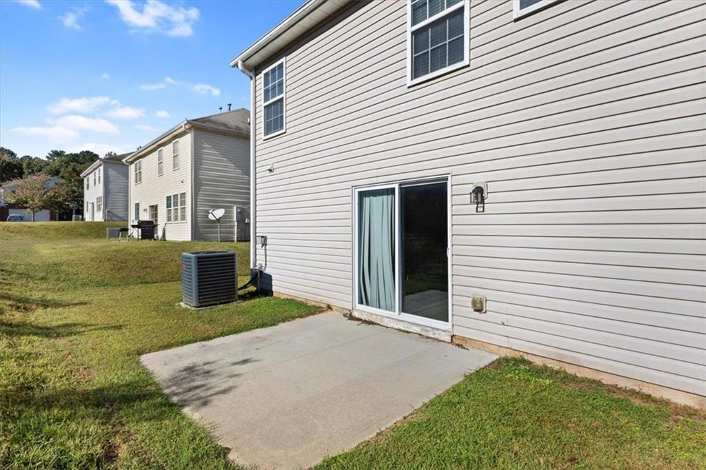 2068 White Top Road Southeast Lawrenceville, GA 30045 - Photo 37 of 41 a backyard of a house with yard and garage