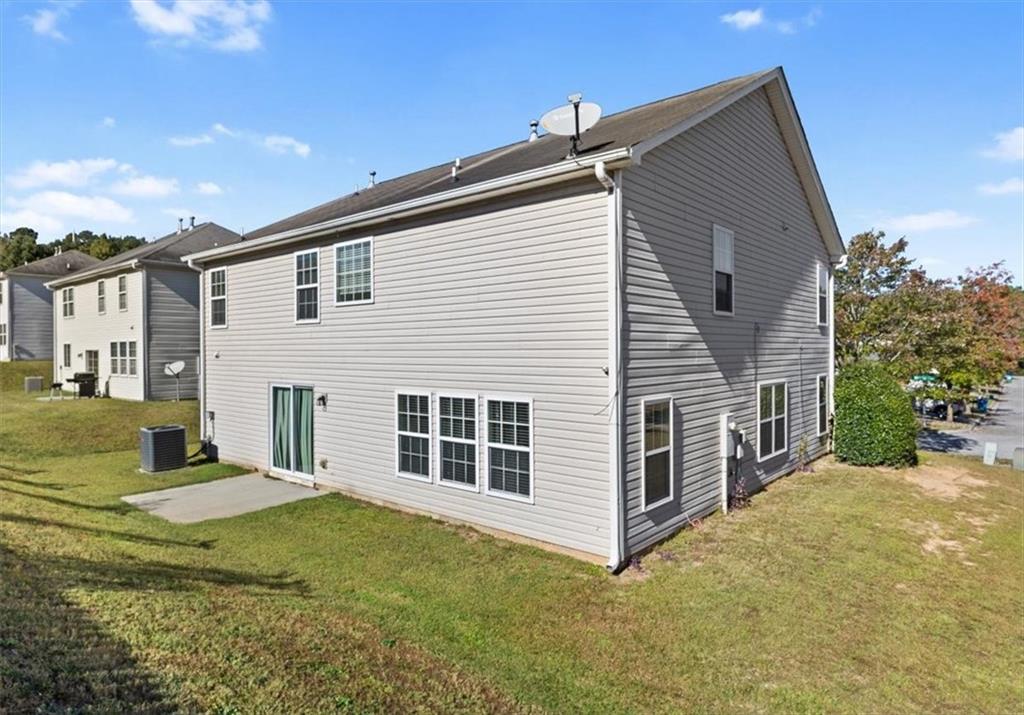 2068 White Top Road Southeast Lawrenceville, GA 30045 - Photo 38 of 41 a view of a house with backyard and sitting area
