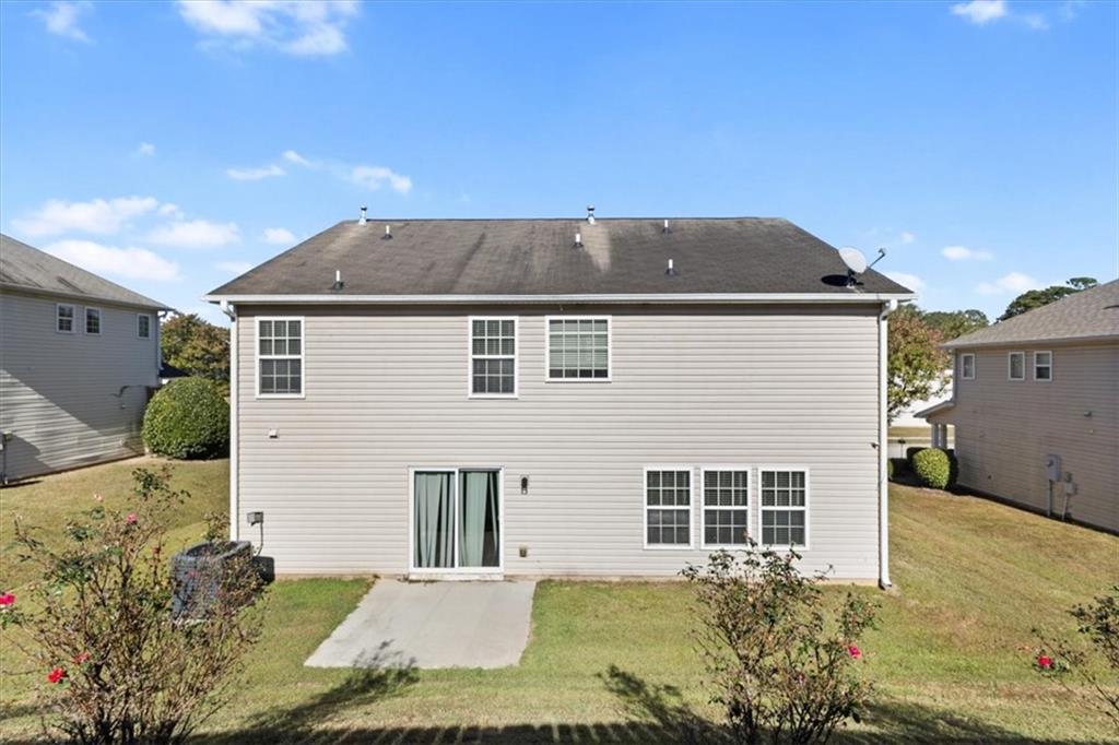 2068 White Top Road Southeast Lawrenceville, GA 30045 - Photo 39 of 41 a view of a house with a yard